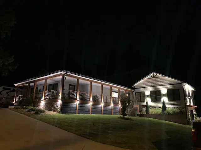 A house with lights on the outside of it